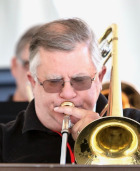 Chuck playing a trombone